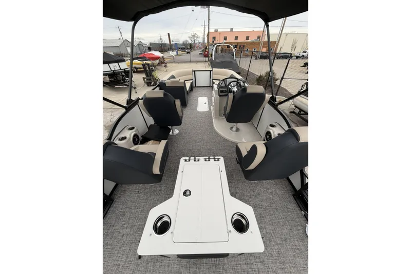 Slide: The Image of 2026 Flagship D22RF Ext. Deck boat interior with seating and steering console. - 8