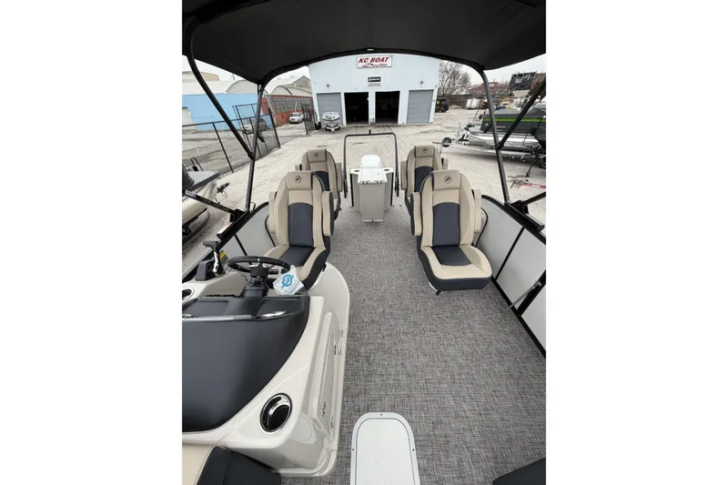 Slide: The Image of 2026 Flagship D22RF Ext. Deck boat interior with seating and steering console. - 9