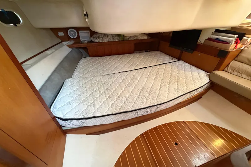 Slide: The Image of Interior cabin of a 1999 Hunter 380 sailboat with a double mattress. - 20