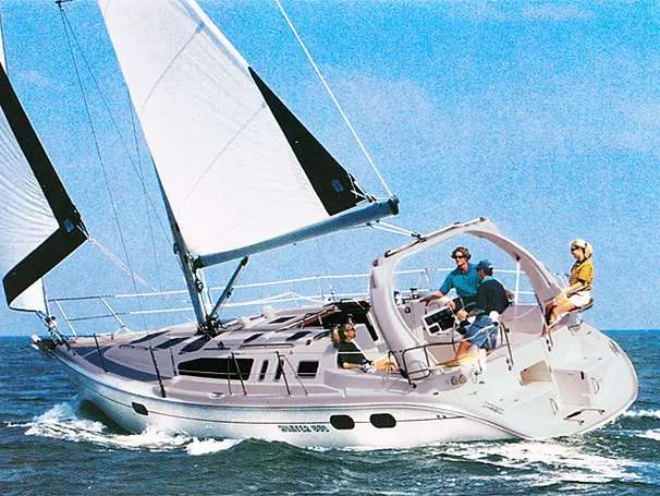 Slide: The Image of 1999 Hunter 380 sailboat cruising on the ocean. - 8