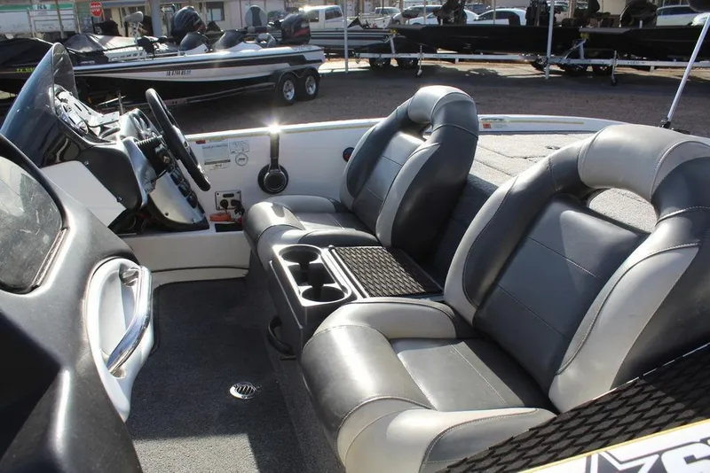 Slide: The Image of 2005 Stratos 201 Pro XL boat interior with dual seats and steering console. - 1