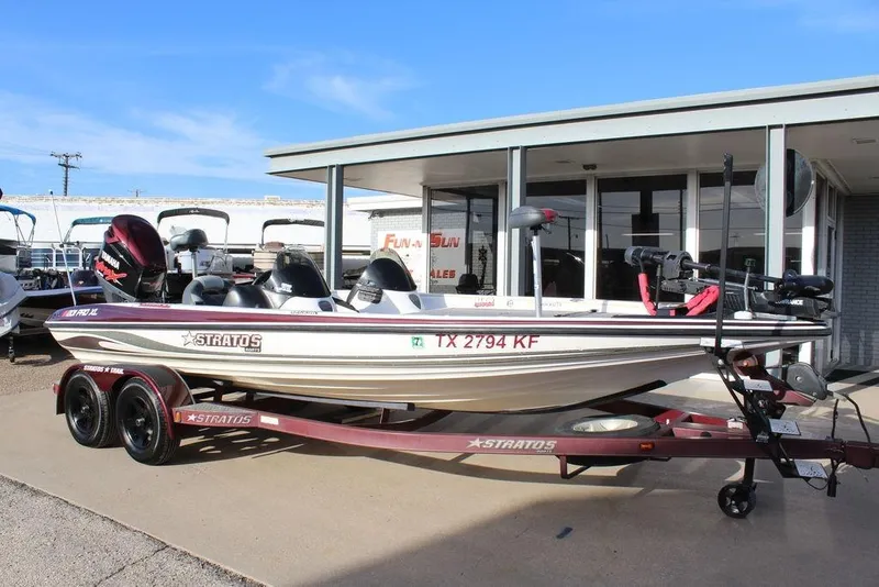 Slide: The Image of 2005 Stratos 201 Pro XL boat on trailer, parked outside dealership. - 13