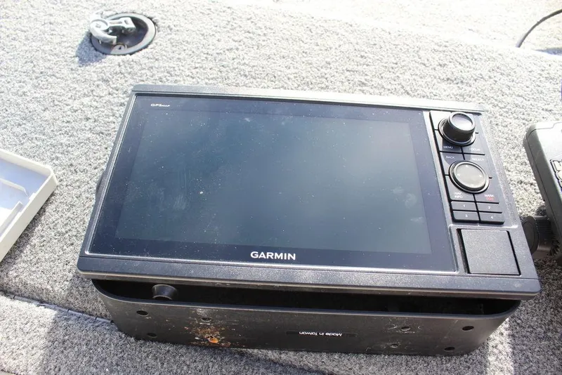 Slide: The Image of Garmin GPS device on 2005 Stratos 201 Pro XL boat dashboard. - 2