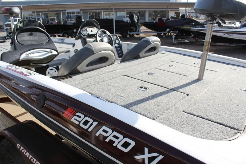 Slide: The Image of 2005 Stratos 201 Pro XL boat interior with seating and control panel. - 5