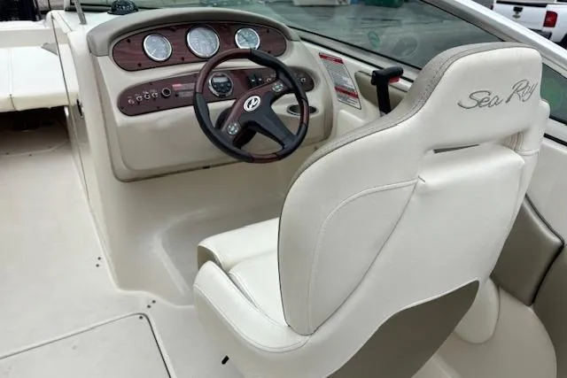 Slide: The Image of 2007 Sea Ray 240 Sundeck boat interior with steering wheel and dashboard. - 12