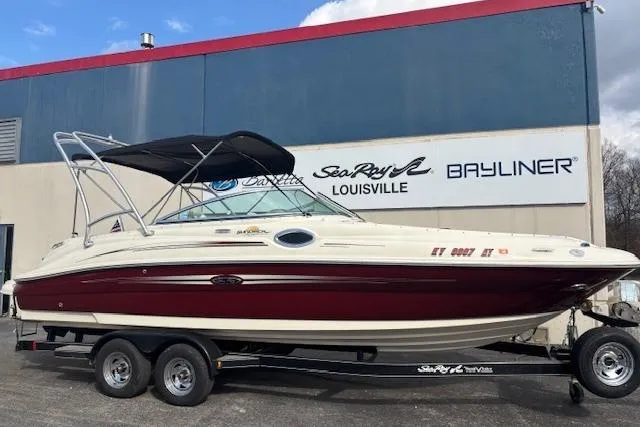 Slide: The Image of 2007 Sea Ray 240 Sundeck boat on trailer, parked outside dealership. - 5