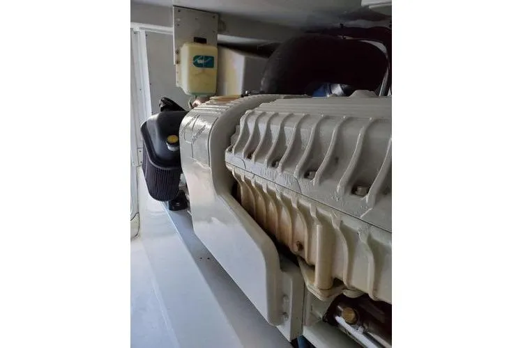 Slide: The Image of Engine compartment of 2005 Luhrs 41 Convertible boat, showcasing detailed machinery. - 11