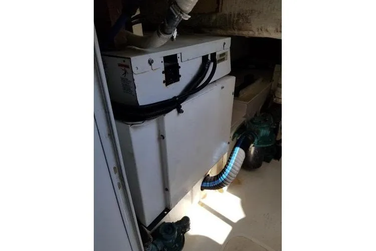 Slide: The Image of Engine room of 2005 Luhrs 41 Convertible boat with visible machinery and piping. - 13