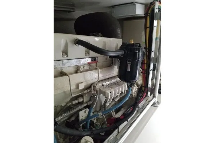 Slide: The Image of Engine compartment of a 2005 Luhrs 41 Convertible boat, showcasing detailed components. - 14