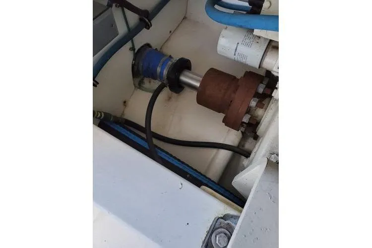 Slide: The Image of Engine compartment of 2005 Luhrs 41 Convertible boat, showing mechanical components and hoses. - 15