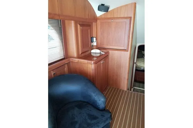 Slide: The Image of Interior of 2005 Luhrs 41 Convertible yacht with wooden cabinetry and seating. - 22