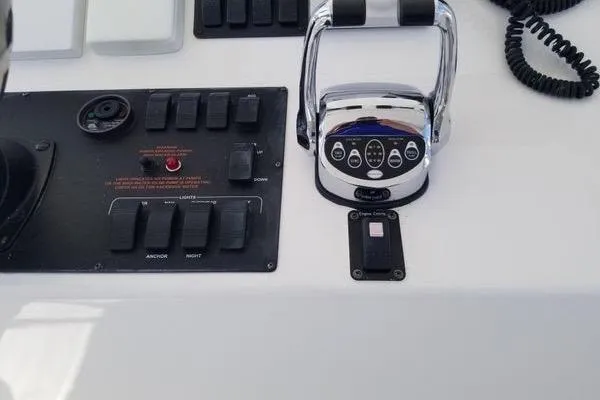 Slide: The Image of Control panel of a 2005 Luhrs 41 Convertible boat with throttle and switches. - 27