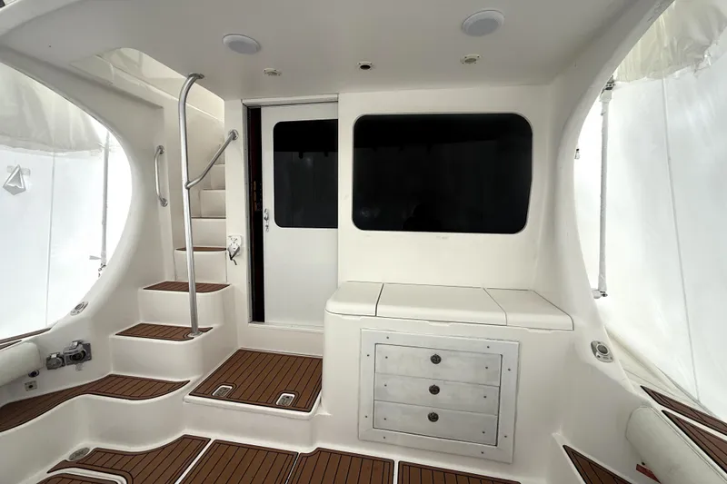 Slide: The Image of 2004 Luhrs 41 Convertible yacht interior with stairs and storage cabinets. - 46