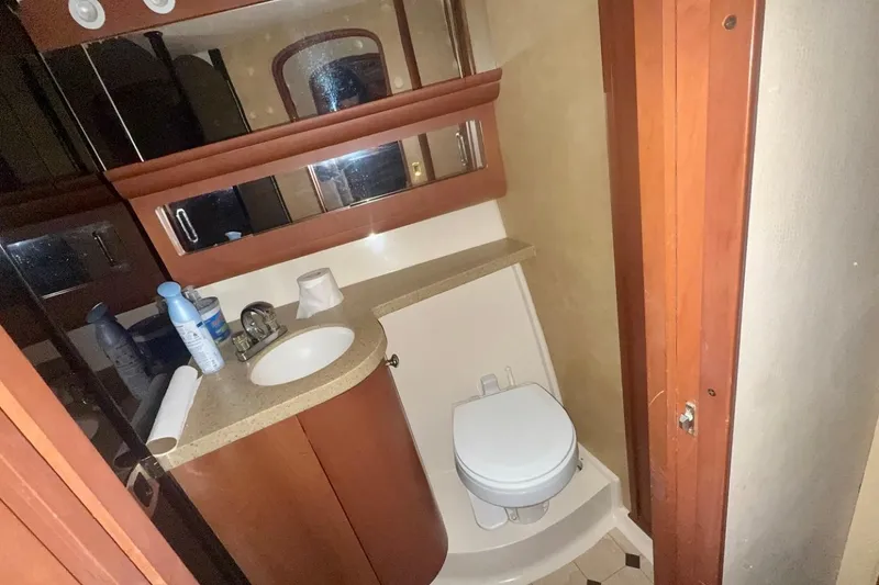 Slide: The Image of Bathroom interior of 2004 Luhrs 41 Convertible yacht with sink and toilet. - 58