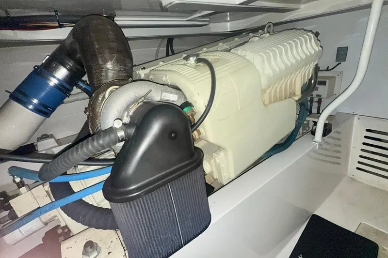 Slide: The Image of Engine compartment of a 2004 Luhrs 41 Convertible boat, showcasing detailed machinery. - 60