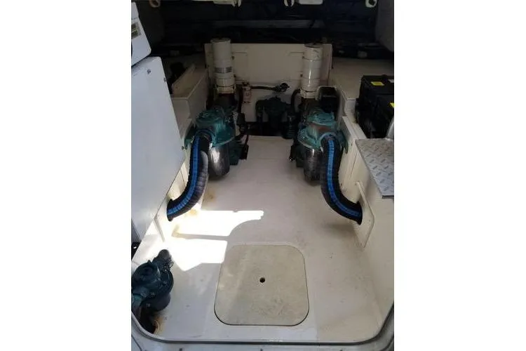 Slide: The Image of Engine room of 2005 Luhrs 41 Convertible boat, showcasing dual engines and components. - 8