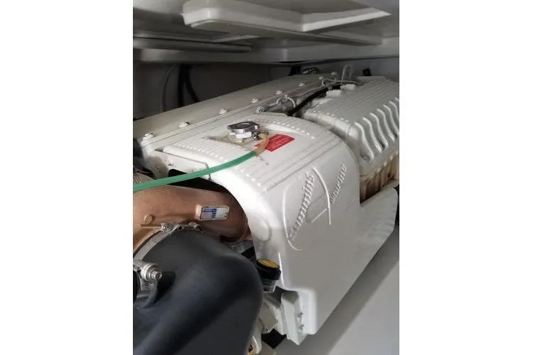 Slide: The Image of Engine compartment of 2005 Luhrs 41 Convertible boat, showcasing detailed machinery. - 9
