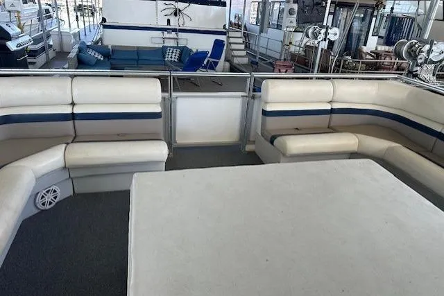 Slide: The Image of Spacious seating area on 2008 Destination Yachts 45X14 houseboat with white and blue upholstery. - 1