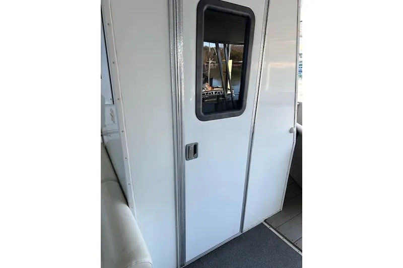 Slide: The Image of 2008 Destination Yachts 45X14 boat interior with steering wheel and seating area. - 12