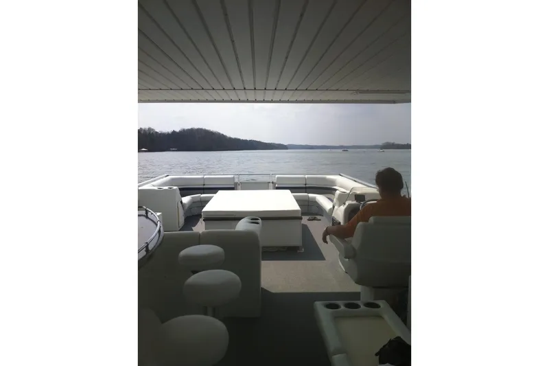 Slide: The Image of 2008 Destination Yachts 45X14 houseboat interior with lake view and seating area. - 27