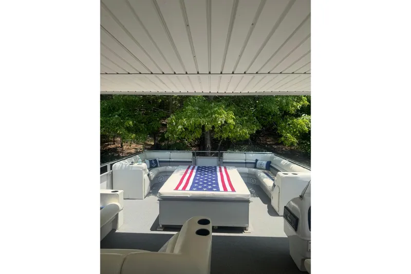 Slide: The Image of Spacious deck of 2008 Destination Yachts 45X14 with American flag decor. - 29