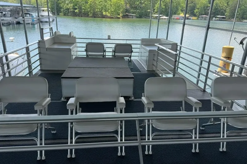 Slide: The Image of Upper deck of 2008 Destination Yachts 45X14, featuring seating and scenic lake view. - 32