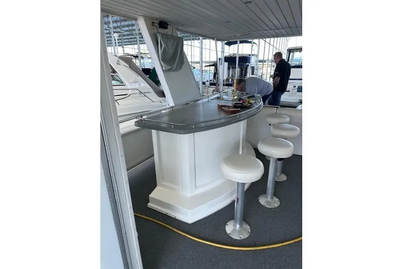 Slide: The Image of Luxurious interior of 2008 Destination Yachts 45X14, featuring plush seating and "Regatta Queen" sign. - 6