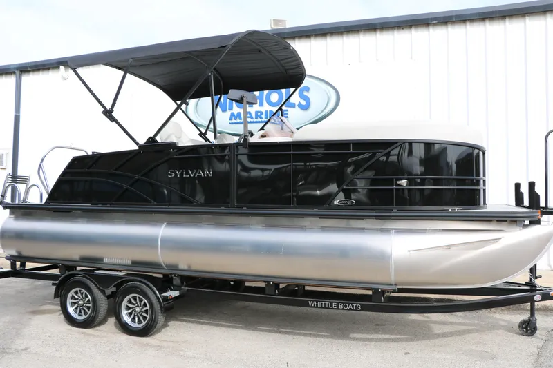 The Image of 2025 Sylvan MIRAGE 822 CLZ DH pontoon boat on trailer, black and silver design. - 0