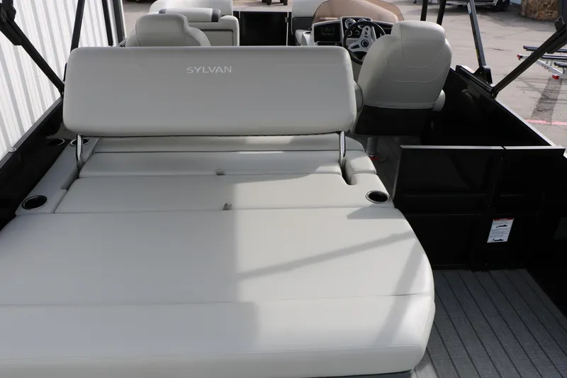 Slide: The Image of 2025 Sylvan MIRAGE 822 CLZ DH boat interior with plush seating and modern design. - 14