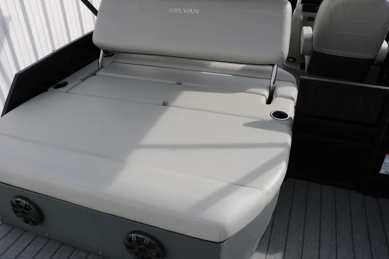 Slide: The Image of 2025 Sylvan MIRAGE 822 CLZ DH boat interior with cushioned seating and cup holders. - 15
