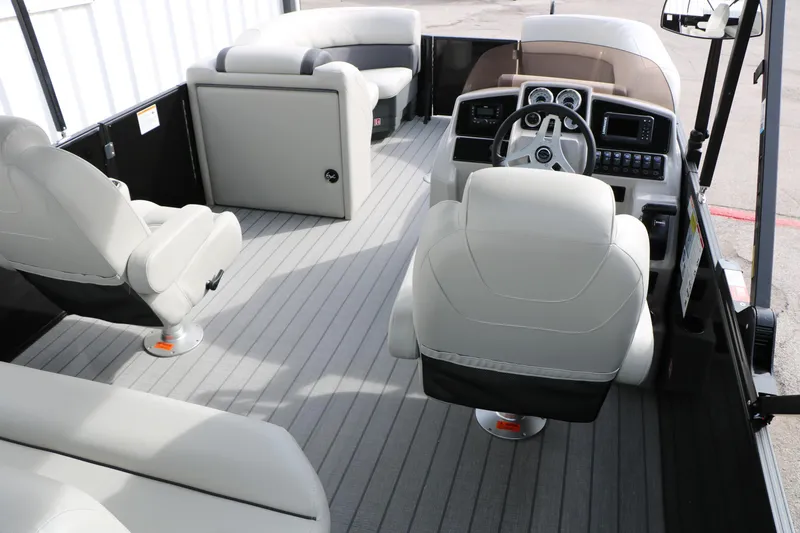 Slide: The Image of 2025 Sylvan MIRAGE 822 CLZ DH boat interior with modern seating and steering console. - 17