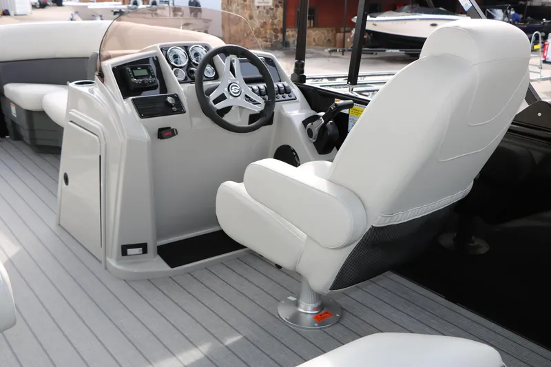 Slide: The Image of 2025 Sylvan MIRAGE 822 CLZ DH boat interior with steering console and captain's chair. - 18