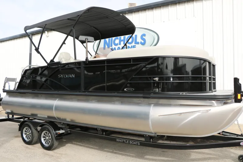 Slide: The Image of 2025 Sylvan MIRAGE 822 CLZ DH pontoon boat on trailer, black exterior. - 2