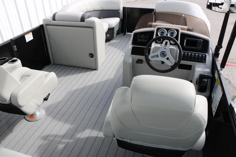 Slide: The Image of 2025 Sylvan MIRAGE 822 CLZ DH boat interior with modern helm and seating. - 21