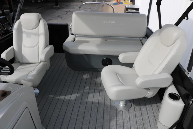 Slide: The Image of 2025 Sylvan MIRAGE 822 CLZ DH boat interior with plush seating and modern design. - 22