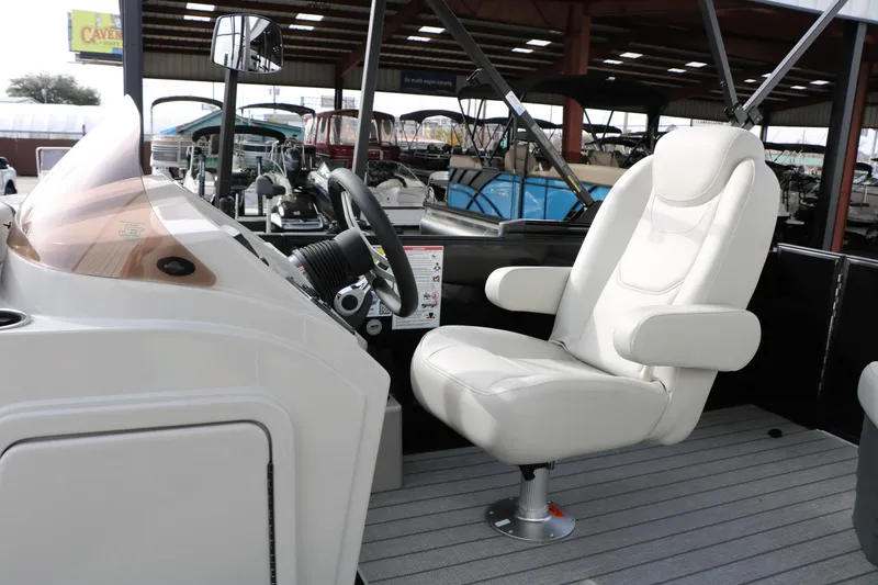 Slide: The Image of Captain's seat of 2025 Sylvan MIRAGE 822 CLZ DH boat, featuring sleek design and modern controls. - 23
