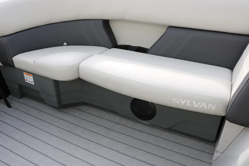 Slide: The Image of 2025 Sylvan MIRAGE 822 CLZ DH boat interior seating, featuring sleek gray and white upholstery. - 24