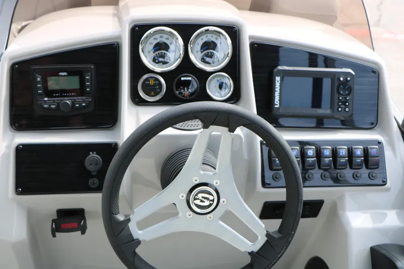 Slide: The Image of 2025 Sylvan MIRAGE 822 CLZ DH dashboard with steering wheel, gauges, and navigation controls. - 27