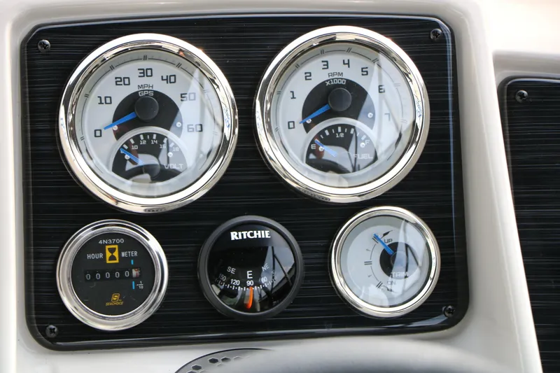 Slide: The Image of Dashboard gauges of 2025 Sylvan MIRAGE 822 CLZ DH boat, featuring speedometer and fuel indicators. - 30