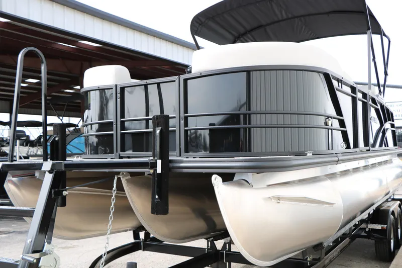 Slide: The Image of 2025 Sylvan MIRAGE 822 CLZ DH pontoon boat on trailer, under covered storage. - 5
