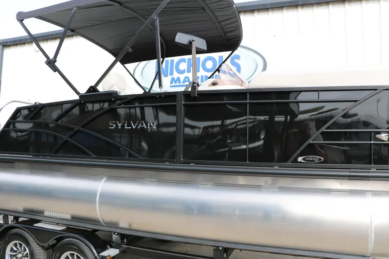 Slide: The Image of 2025 Sylvan MIRAGE 822 CLZ DH pontoon boat with sleek black design. - 6