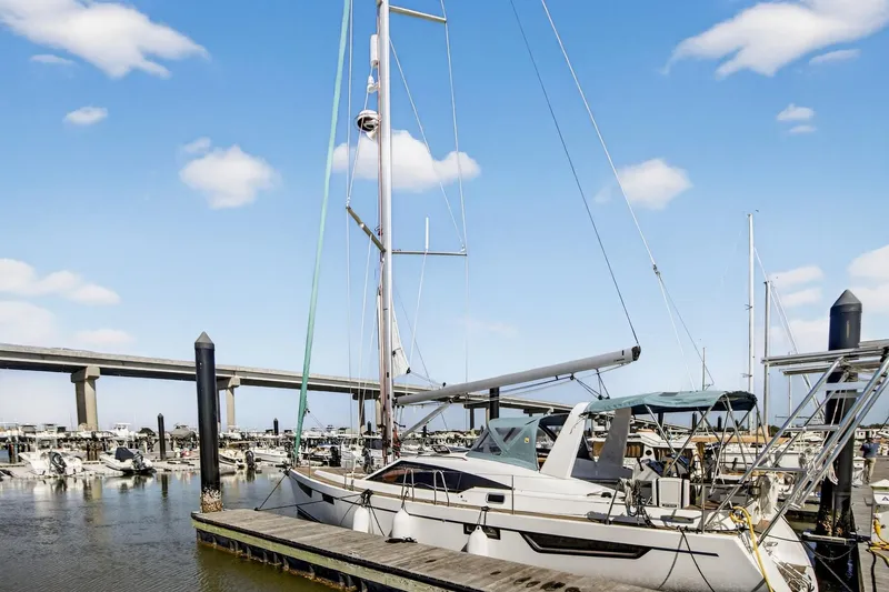 Slide: The Image of 2024 Southerly 420 sailboat docked at marina under blue sky. - 4