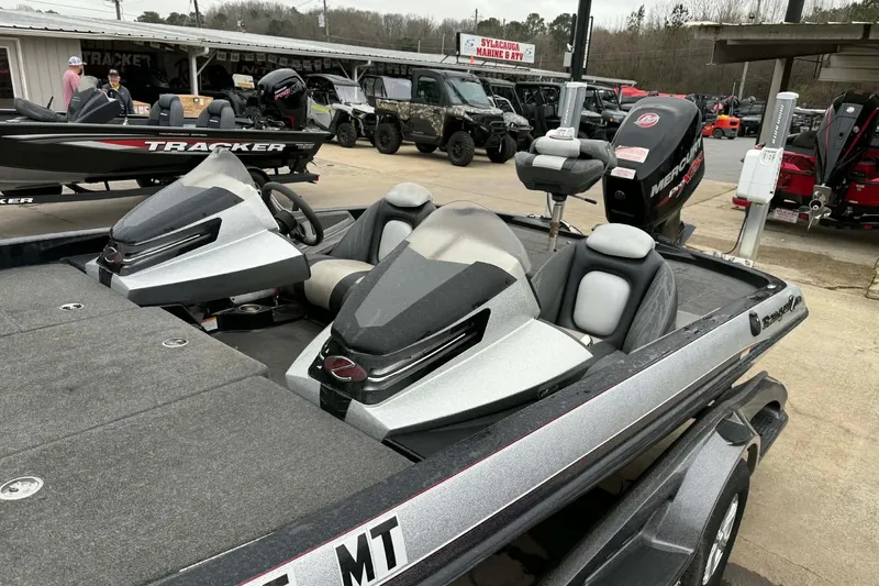 Slide: The Image of 2015 Ranger Z118 Comanche fishing boat with dual seats and Mercury engine at dealership. - 6