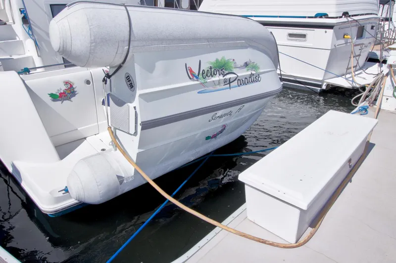Slide: The Image of 2007 Meridian 459 Motoryacht docked with inflatable boat, "Vectors of Paradise," in Sarasota, FL. - 100