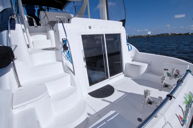 Slide: The Image of 2007 Meridian 459 Motoryacht deck with stairs, sliding door, and ocean view. - 14