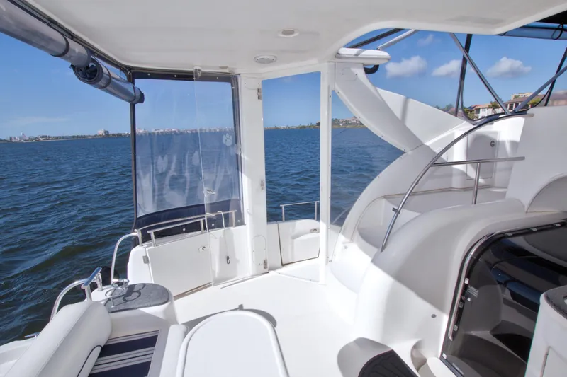 Slide: The Image of 2007 Meridian 459 Motoryacht interior with ocean view, featuring sleek design and comfortable seating. - 18