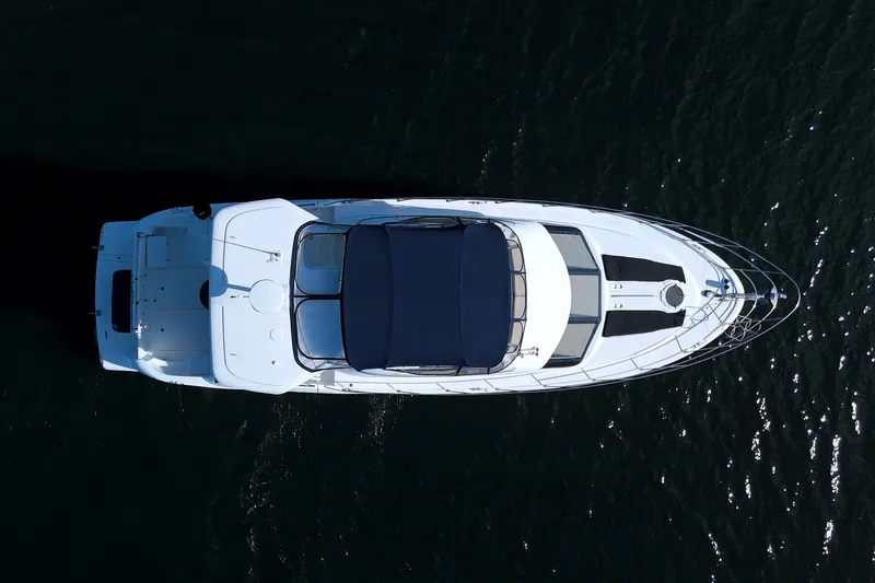 Slide: The Image of Aerial view of 2007 Meridian 459 Motoryacht on dark water. - 2
