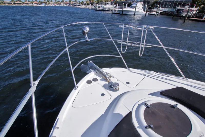 Slide: The Image of Bow view of 2007 Meridian 459 Motoryacht on calm waters near marina. - 22
