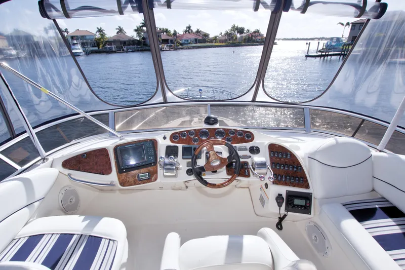Slide: The Image of Luxurious 2007 Meridian 459 Motoryacht helm with scenic waterfront view. - 30