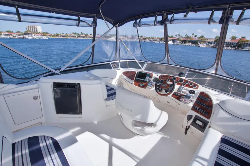 Slide: The Image of 2007 Meridian 459 Motoryacht helm with panoramic water view and modern controls. - 31